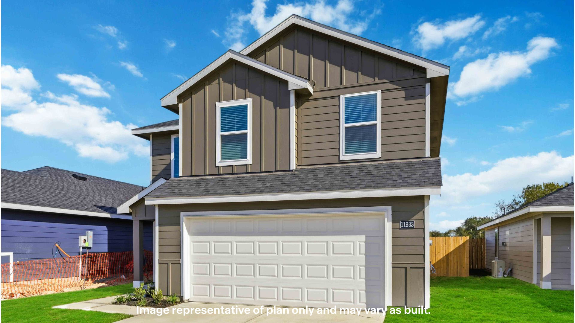 Side view of two story timeless brick home