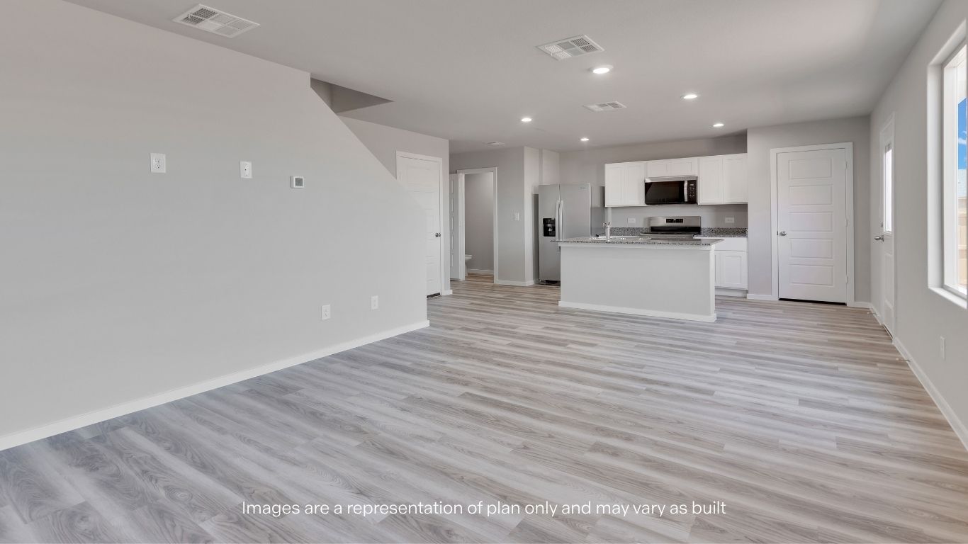 Natural light fills the expansive downstairs living area, enhancing the home's bright and inviting atmosphere.