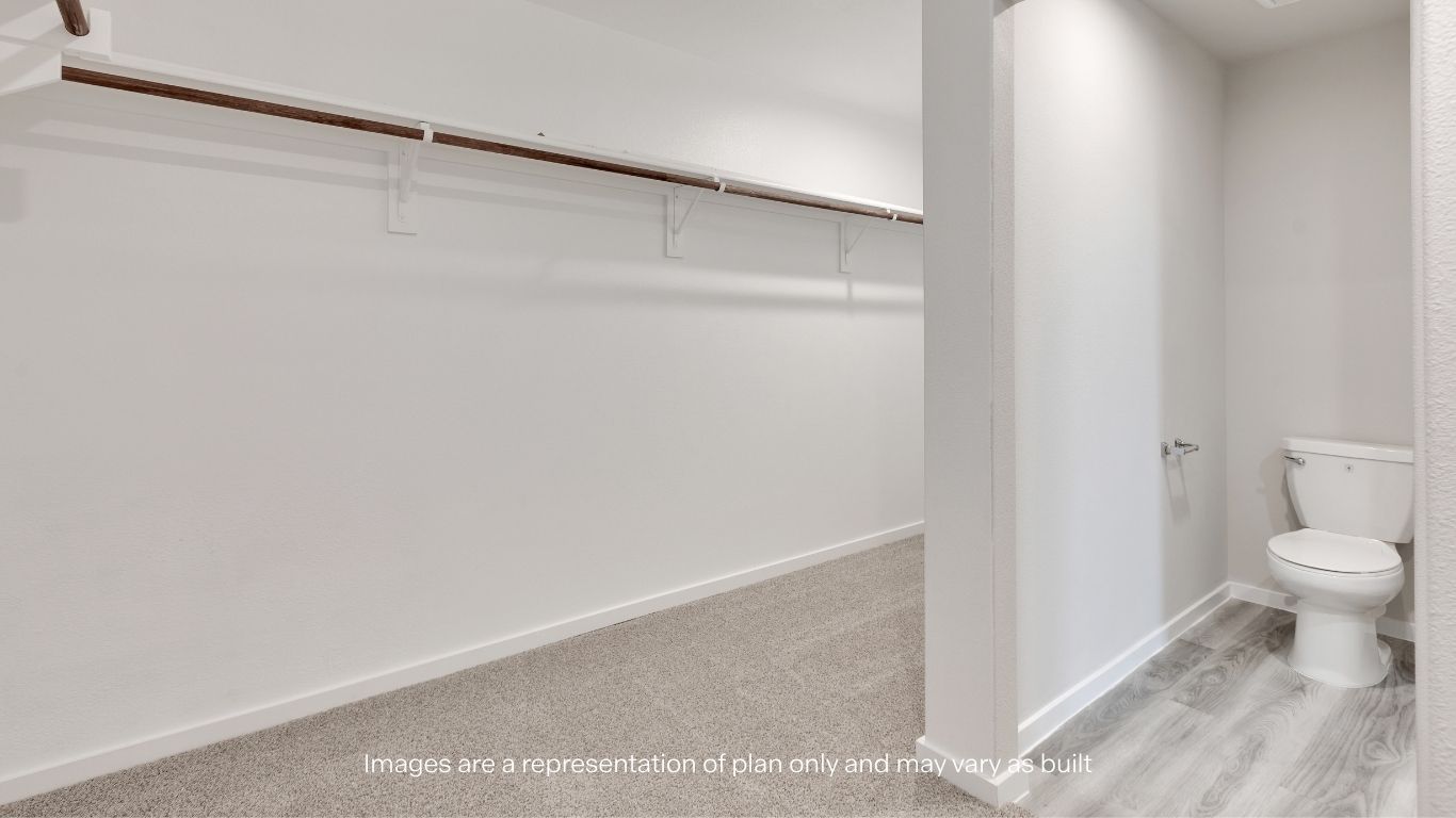 Enjoy a well-appointed primary suite complete with a walk-in shower and direct access to an oversized walk-in closet.