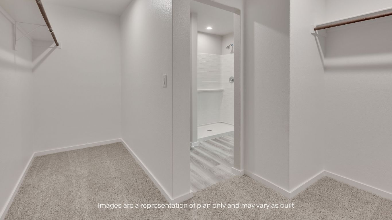 With generous hanging space and room for personalization, the primary closet adds both convenience and functionality.