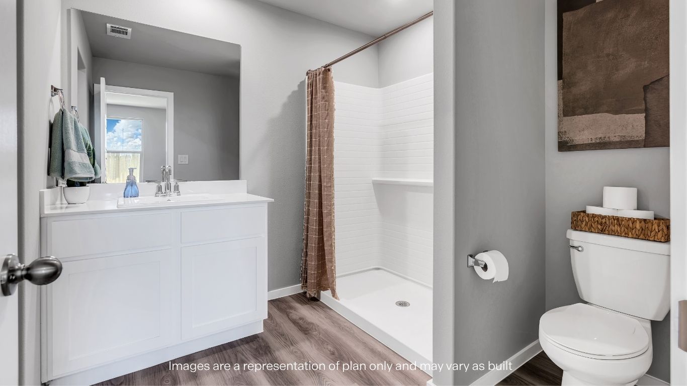 Private attached primary bathroom with built in vanity