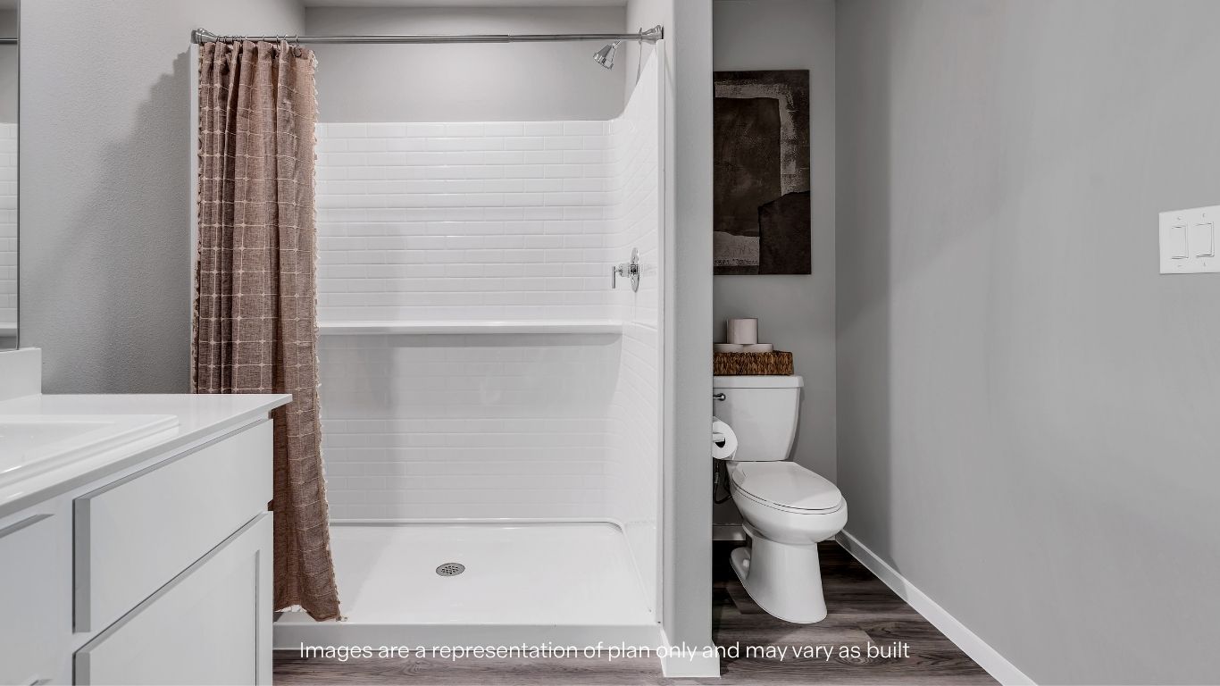 Primary bathroom with luxurious shower and built in storage