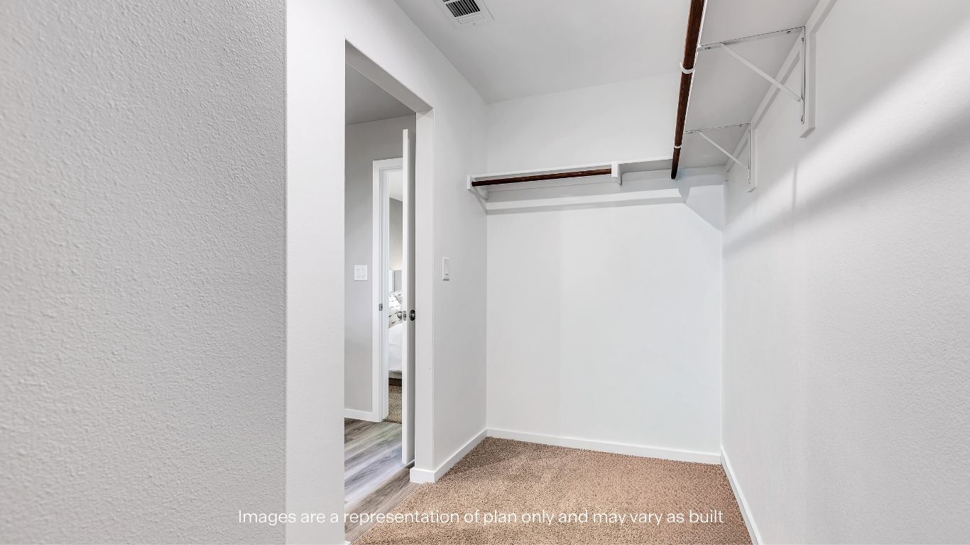 Primary walk-in closet with extra storage space