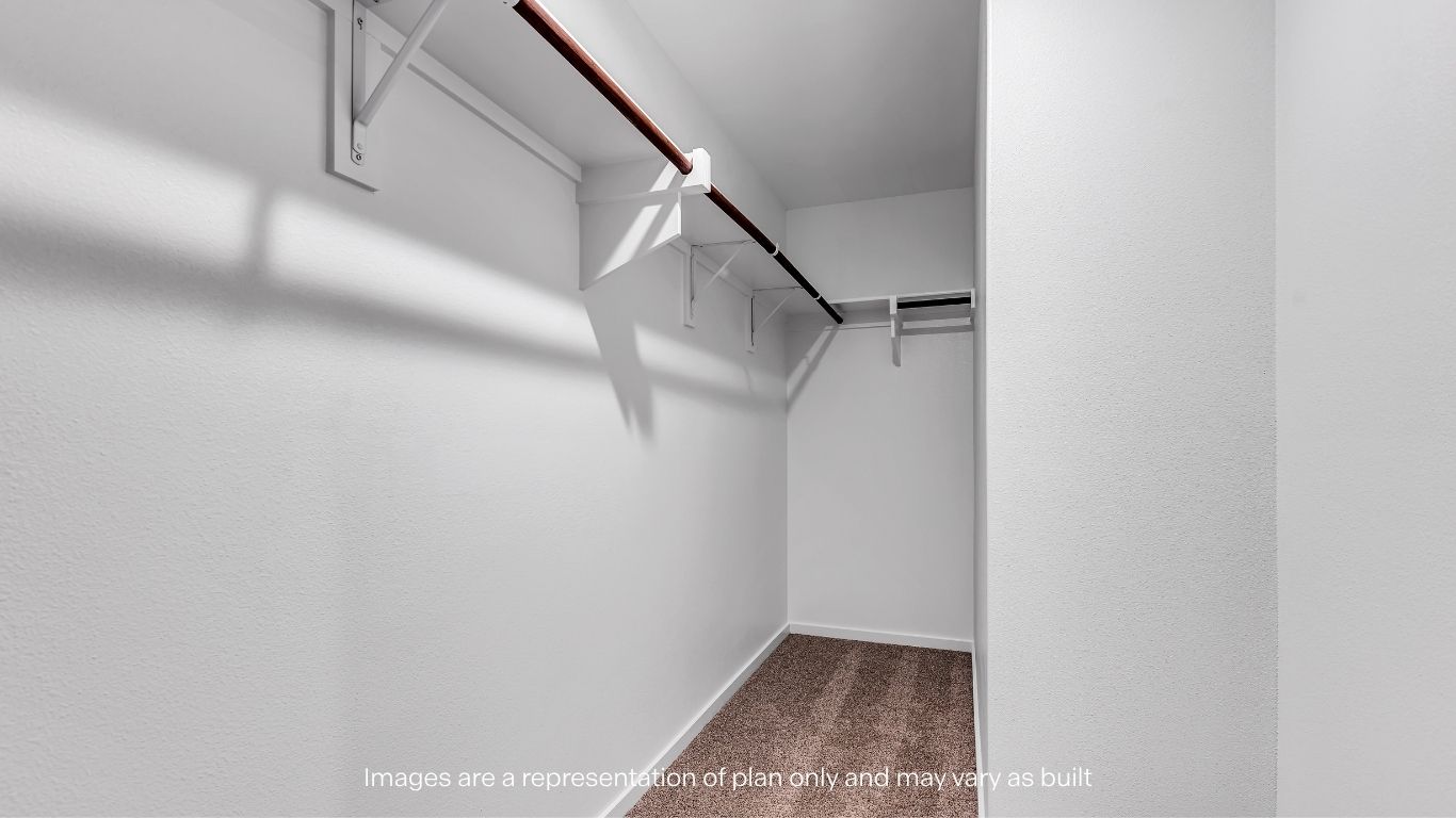 Guest Bedroom walk-in closet with extra storage space
