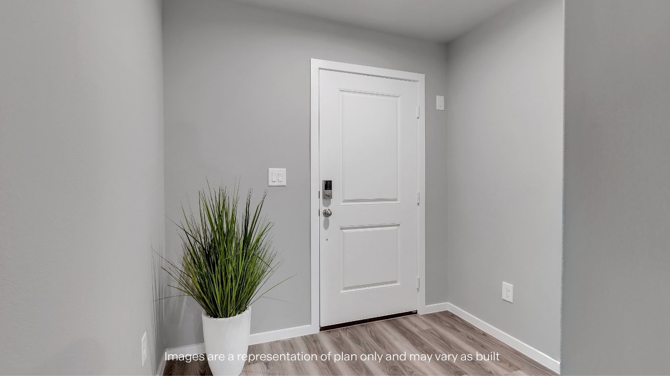 Spacious open entry space with guest bedrooms to the side