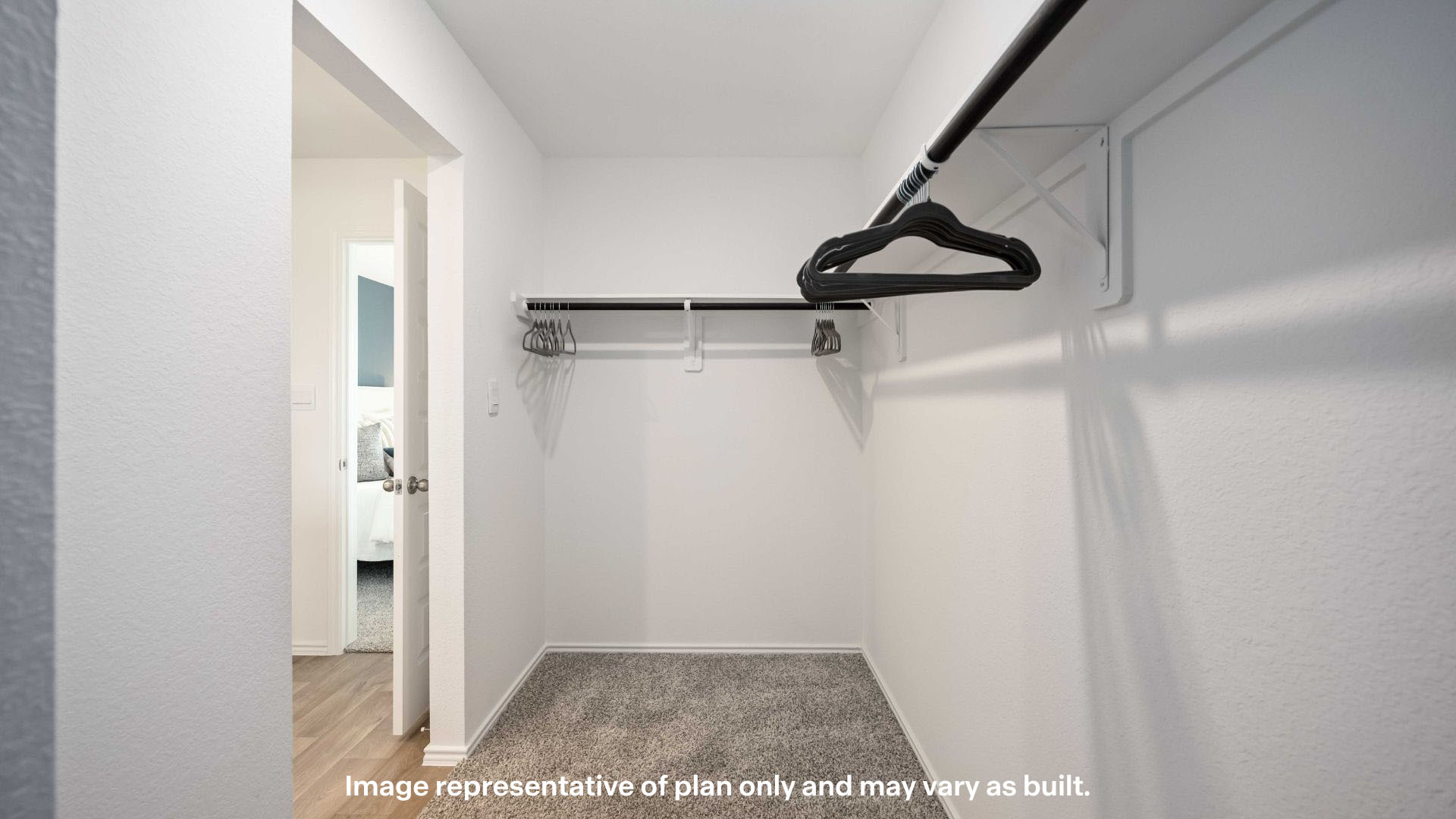 Primary walk-in closet with extra storage space