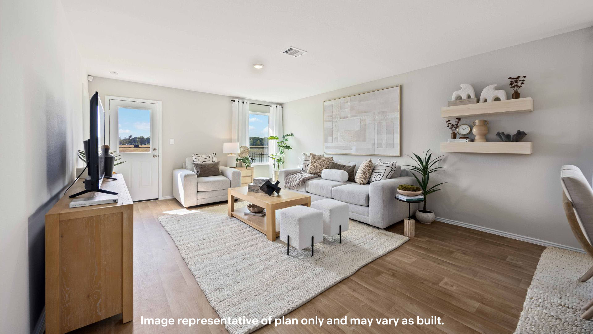 Spacious living and family room space with light allowing windows