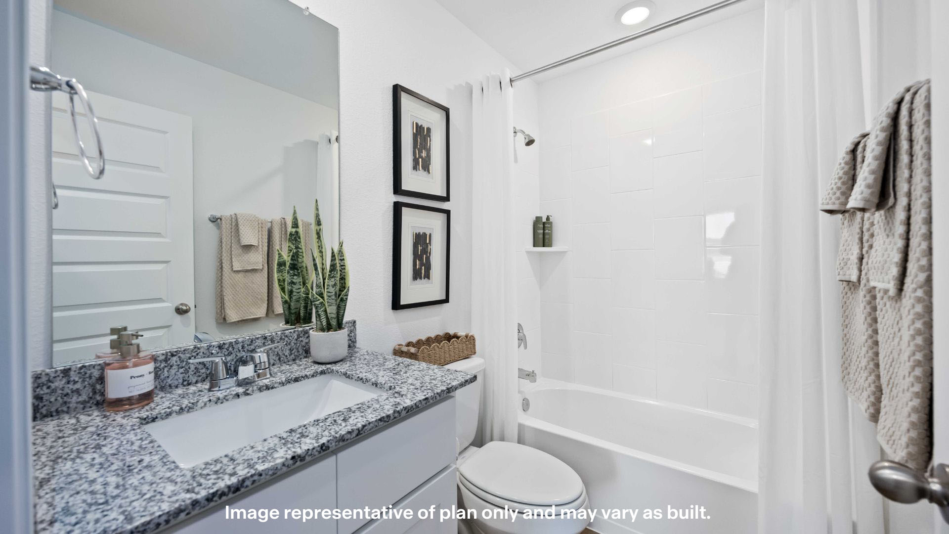 Guest bathroom with built in vanity and combination bathtub shower
