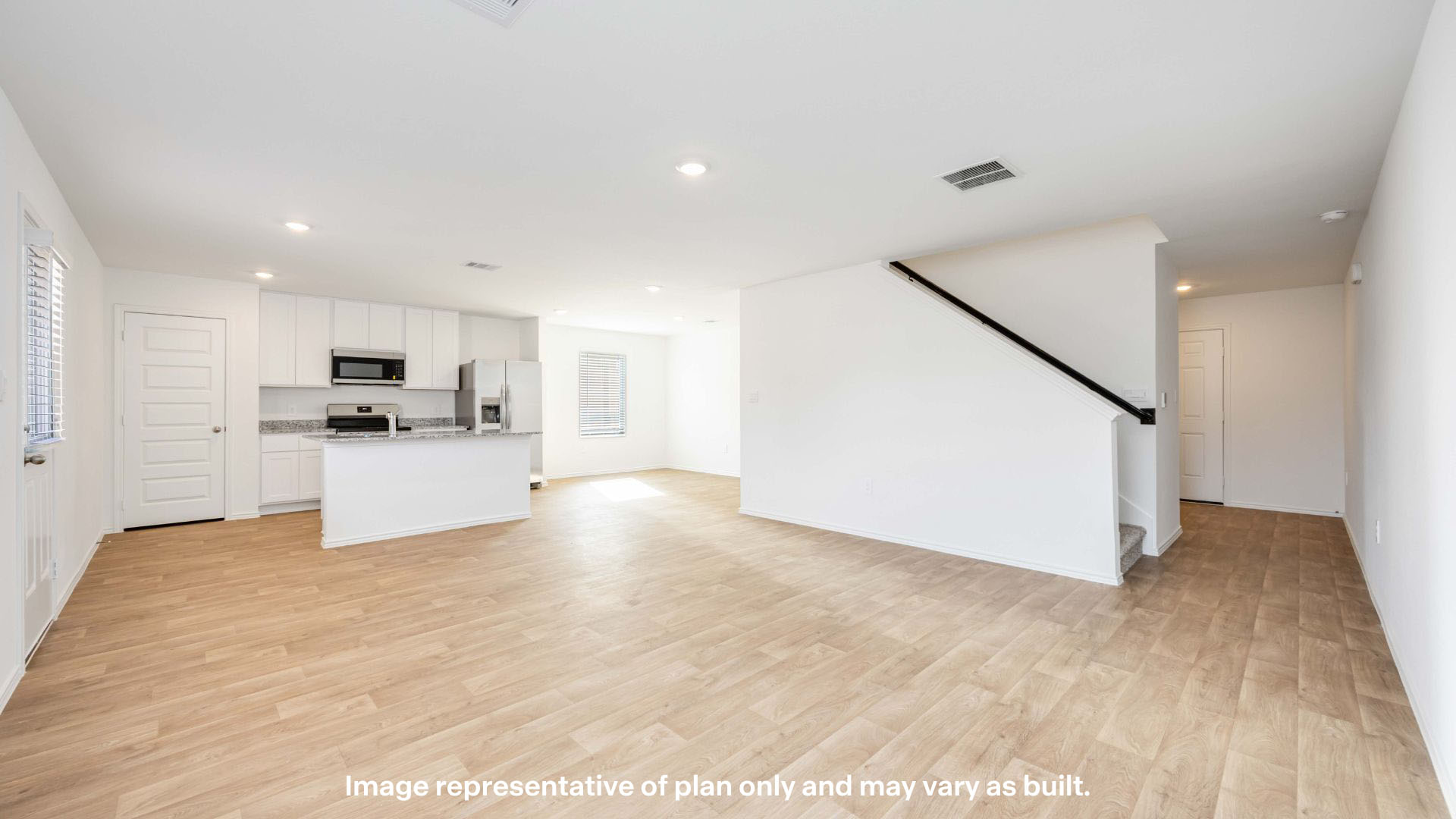 Spacious living and family room space with light allowing windows