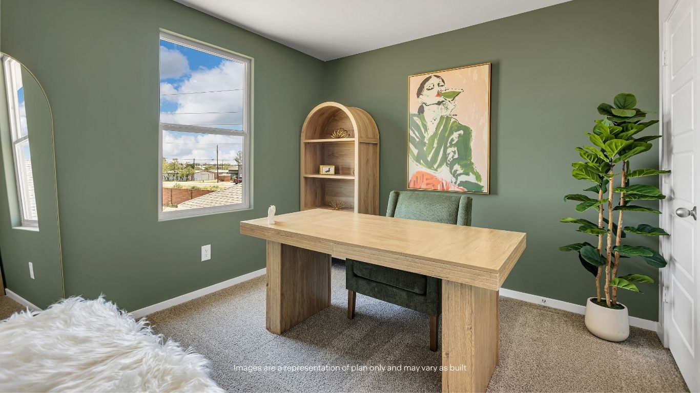 One of four secondary bedrooms, this versatile space can easily serve as a home office, hobby room, or guest retreat.