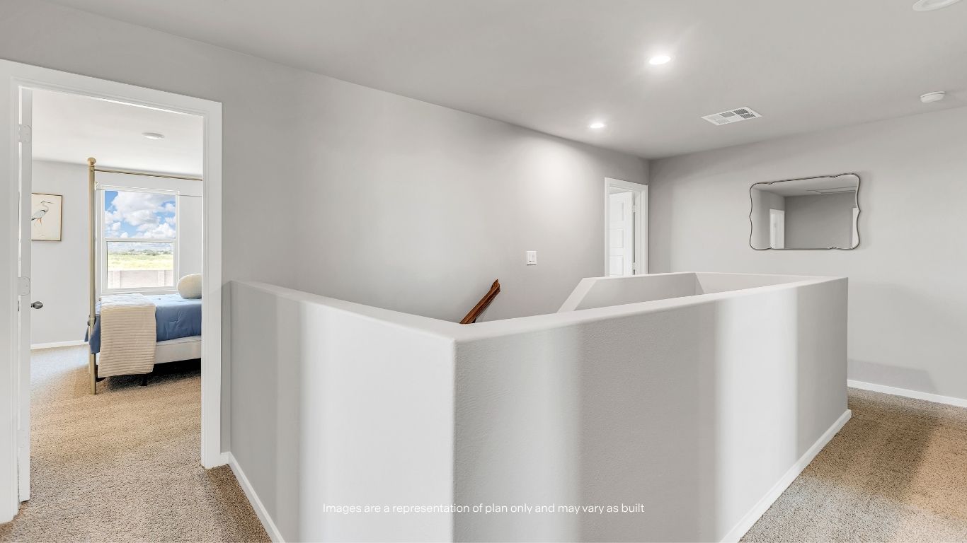 The spacious upstairs landing provides easy access to all bedrooms, the laundry room, and shared bathroom.