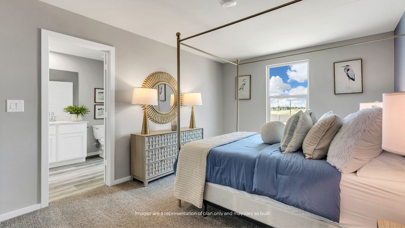 The private primary suite offers ample space, plush carpeting, and a peaceful retreat at the end of the day.