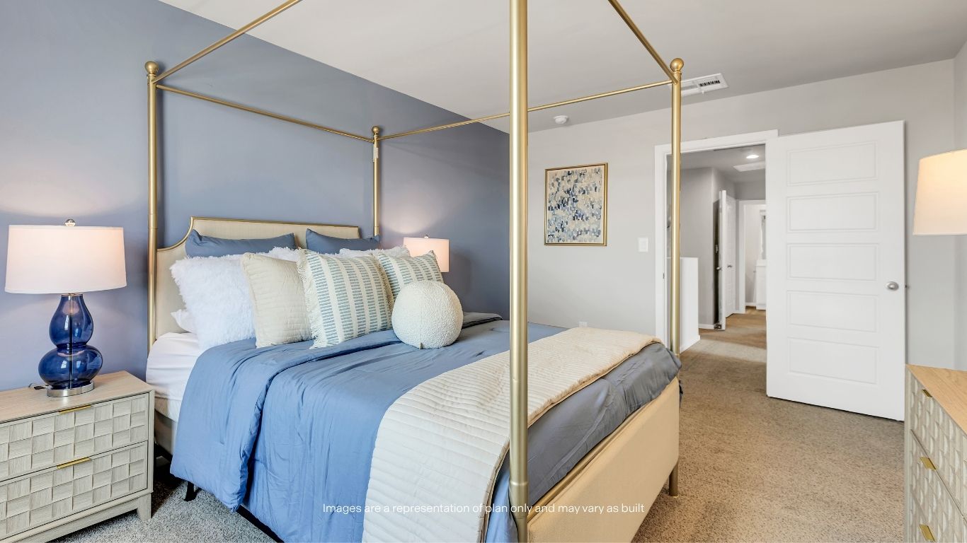 Relax and unwind in this spacious primary bedroom designed with comfort and functionality in mind.