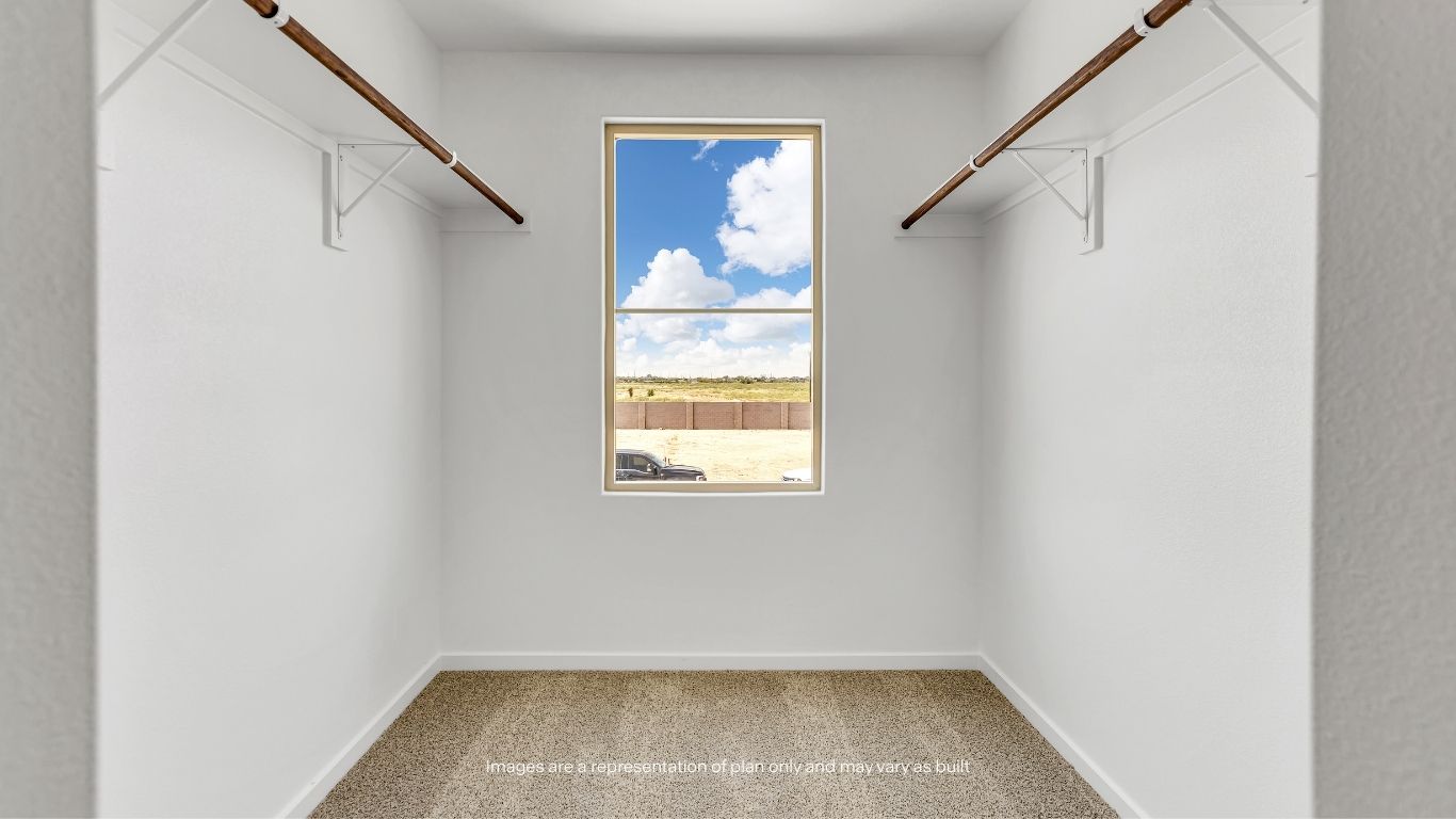 The oversized primary walk-in closet offers abundant storage space for clothing, accessories, and more.
