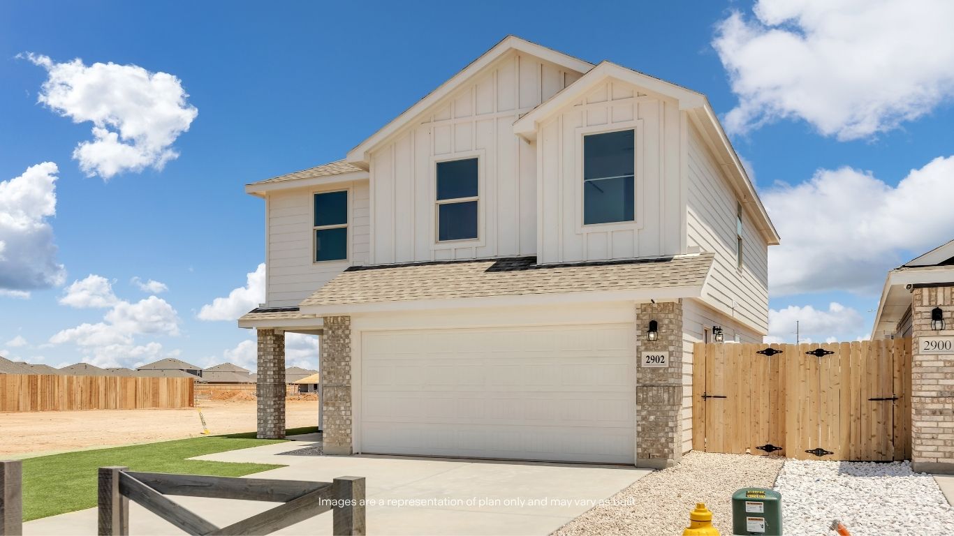 A spacious two-car garage, modern exterior finishes, and clean architectural details create a stylish and functional first impression.