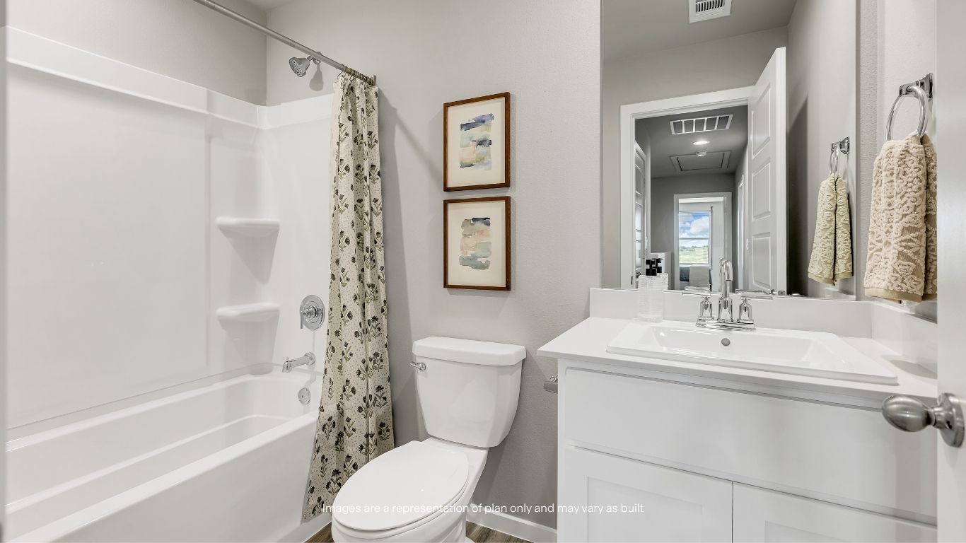 The upstairs full bathroom features a modern vanity, durable finishes, and a convenient shower-tub combination, providing comfort and functionality for family and guests.