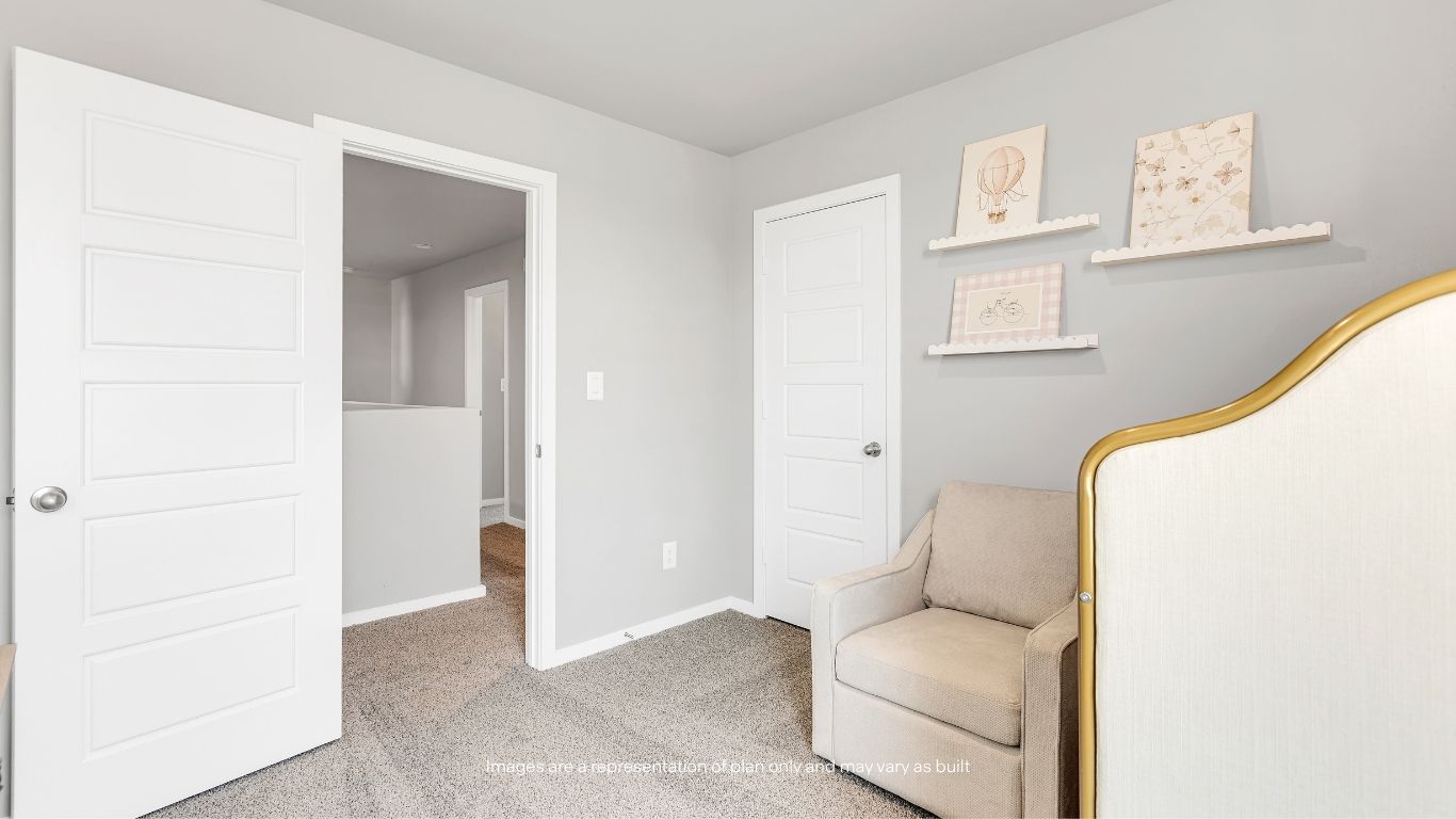 Featuring soft carpeting and a functional layout, this bedroom provides a comfortable retreat with easy access to the upstairs living areas.