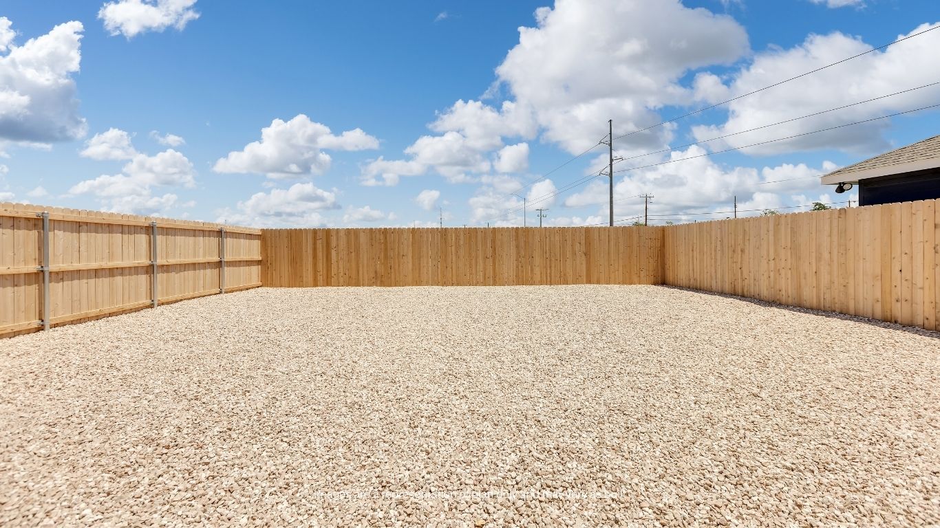 The large backyard offers endless possibilities for creating your own outdoor oasis, with ample space for gatherings, recreation, and relaxation.