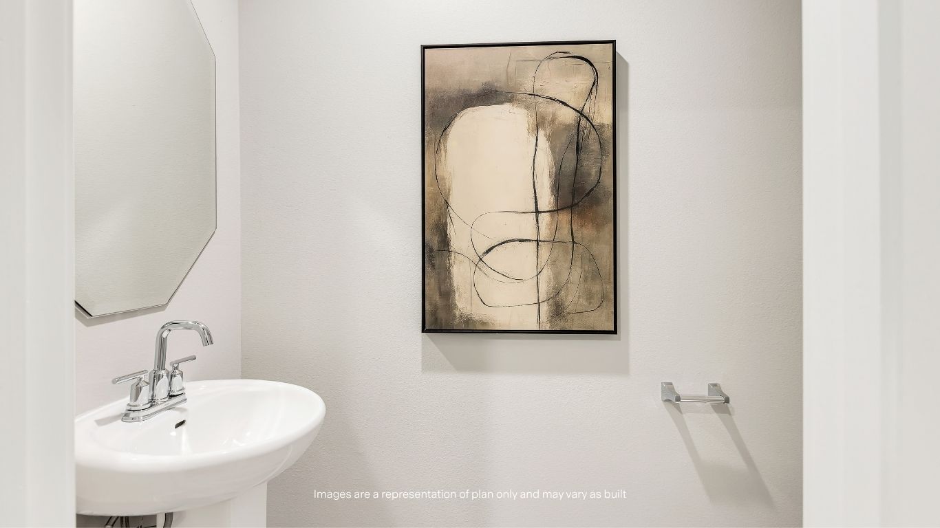Conveniently located near the foyer, the downstairs powder room offers privacy and functionality for guests.