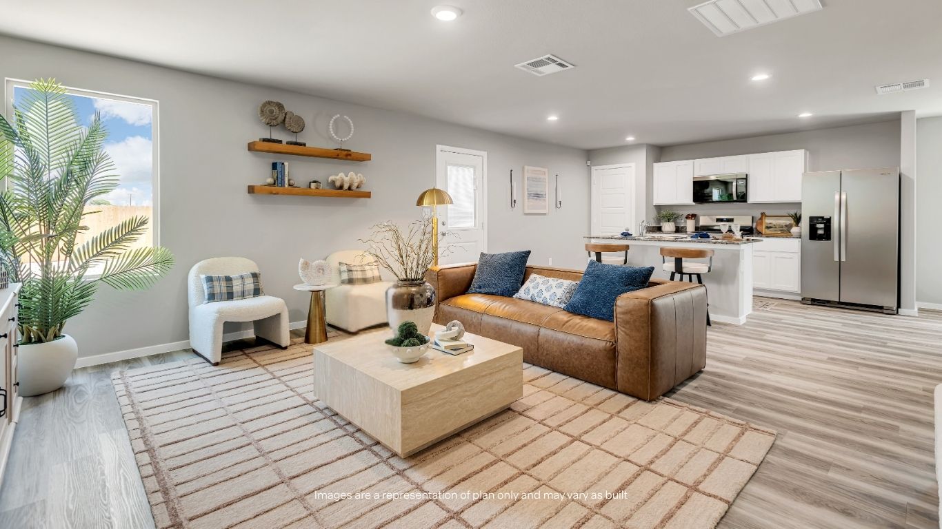 Enjoy a bright and spacious family room that seamlessly connects to the kitchen and dining space, perfect for entertaining and everyday living.