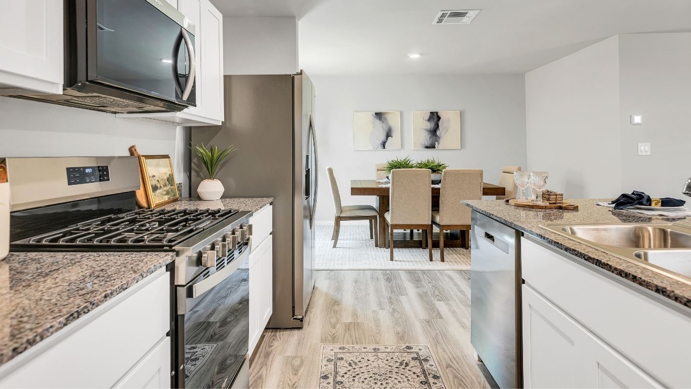 Enjoy a functional kitchen layout that overlooks the dining area, making hosting family meals and gatherings effortless.