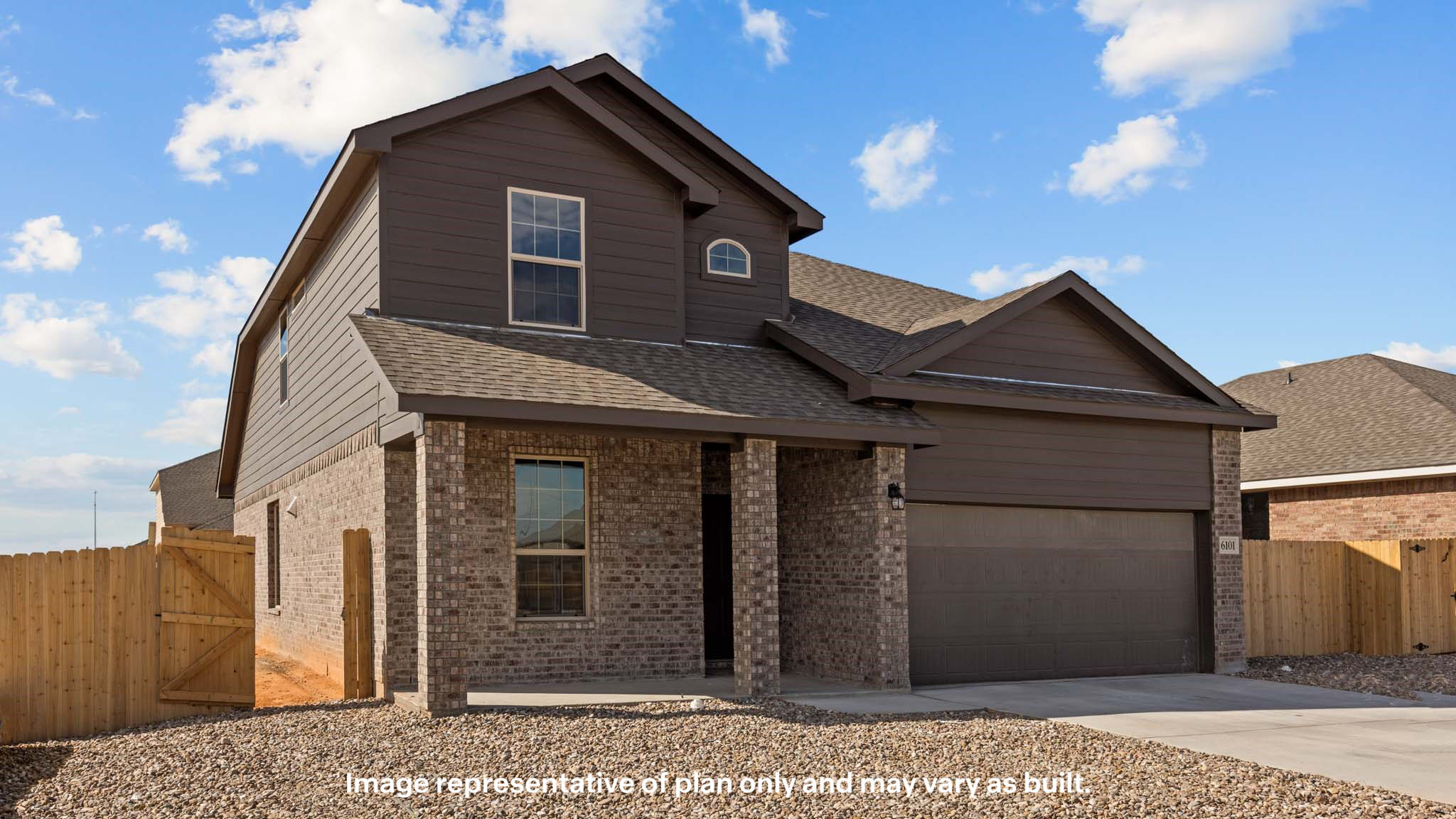 Side view of two story timeless brick home