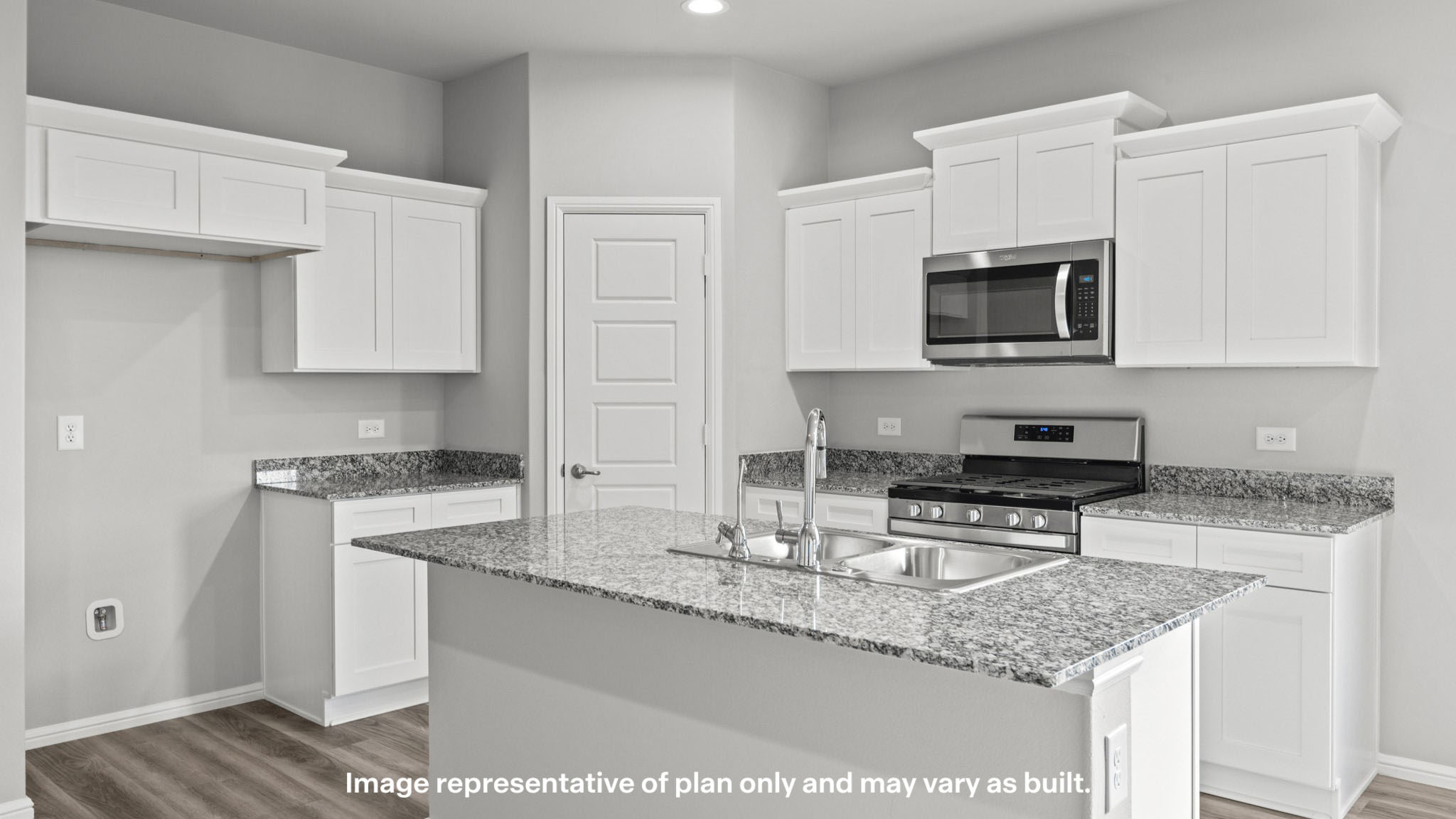 Spacious open concept kitchen with island and counter prep space