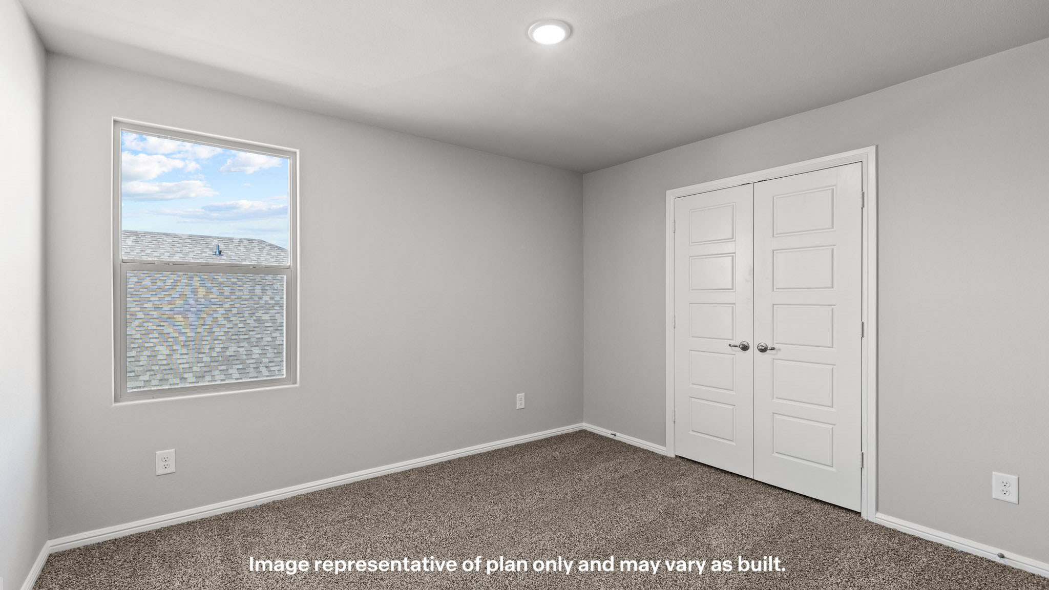 Upstairs guest bedroom 1 with plush carpet floors