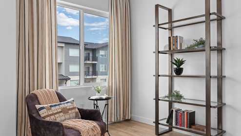 Area near stairs with window.