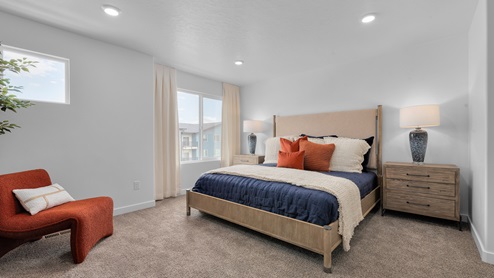 Primary bedroom with one large window and open rectangle window above the bed.