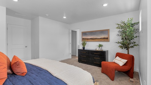Primary bedroom with one large window and open rectangle window above the bed.