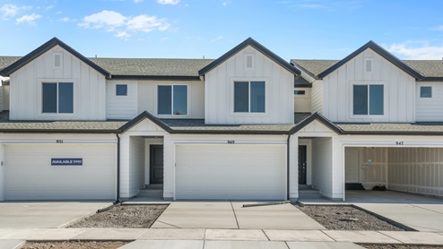 The Oakridge floor plan exterior with white siding and chic black roof makes this new townhome in Saratoga Springs an obvious choice for a new home in Utah county.