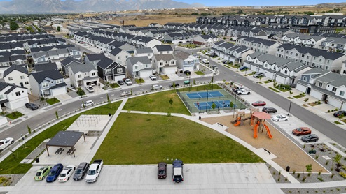 Aerial photo D.R. Horton built homes including community pickleball courts, playground and basketball court in the Little Valley Gateway community in Magna Utah.
