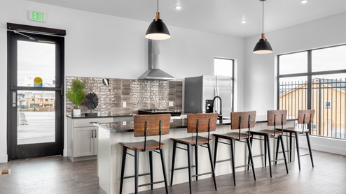Stylish and large kitchen area available for hosting and entertaining at the Little Valley Gateway community clubhouse in Magna Utah.