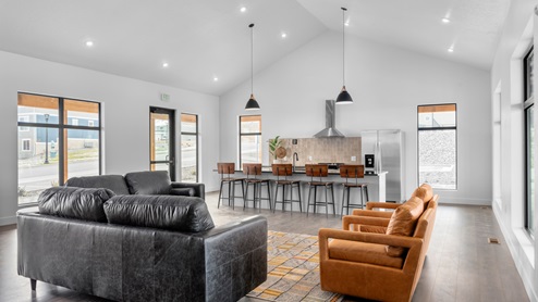 View of the clubhouse’s very large main sitting area and stylish kitchen available for you to rent when you live at the beautiful Little Valley Gateway community.