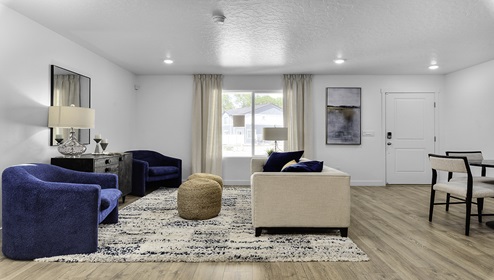 Living room off the entry with large window.