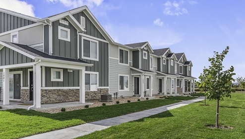 Townhome building exterior with landscaping in Osprey Townhomes in Provo Utah.