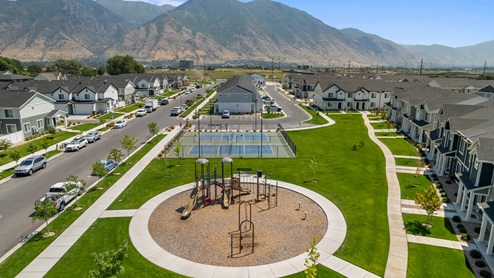 Aerial view of playground and pickleball courts in Osprey Townhomes community in Provo Utah.