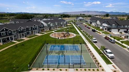 Aerial of playground and pickleball court amenities in Provo Utah.