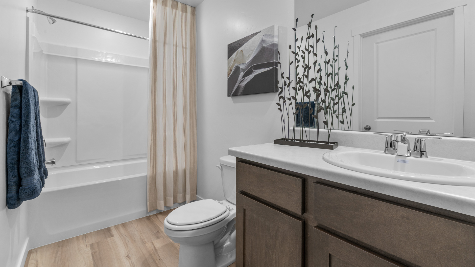 Primary bathroom with shower surround.