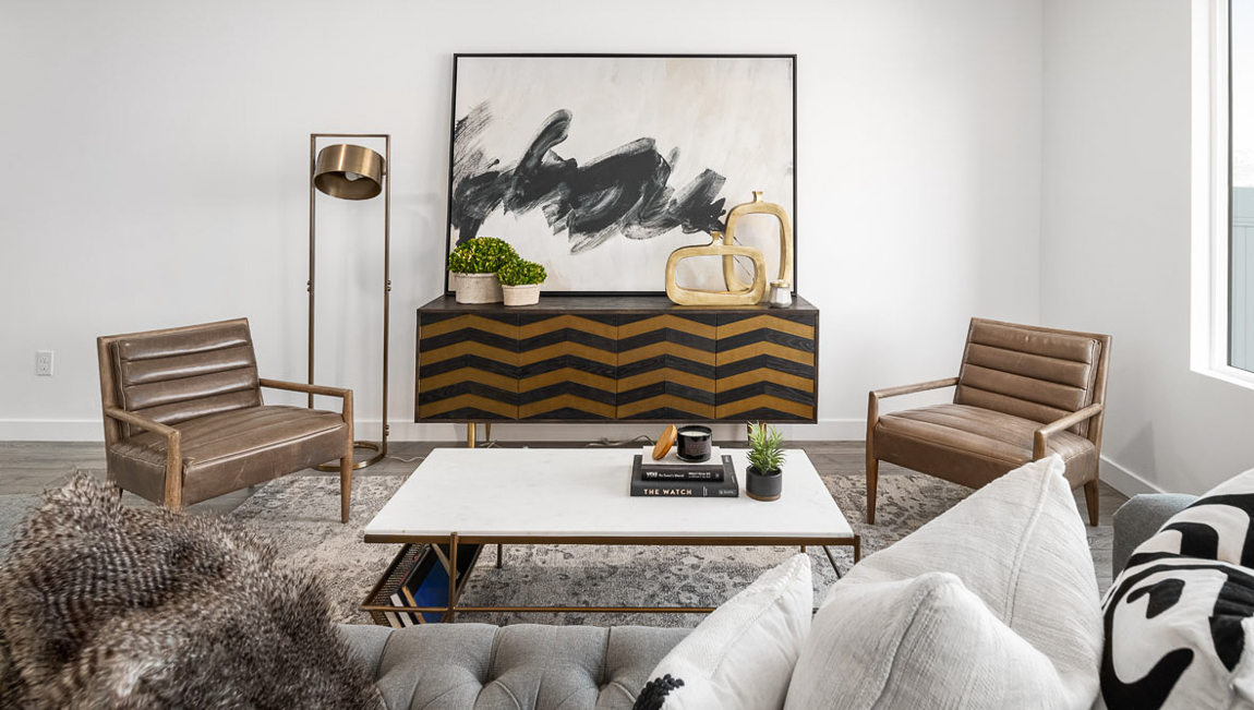 View of the spacious living room with a large window to your right.