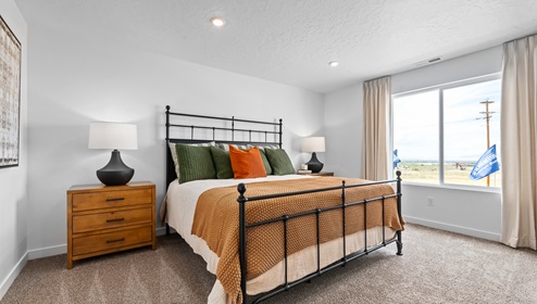 Spacious primary bedrooms with large windows available in Western Acres in Tooele Utah.