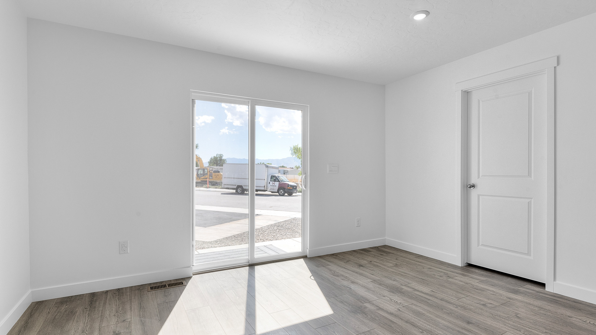 Dining room with large sliding glass doors.