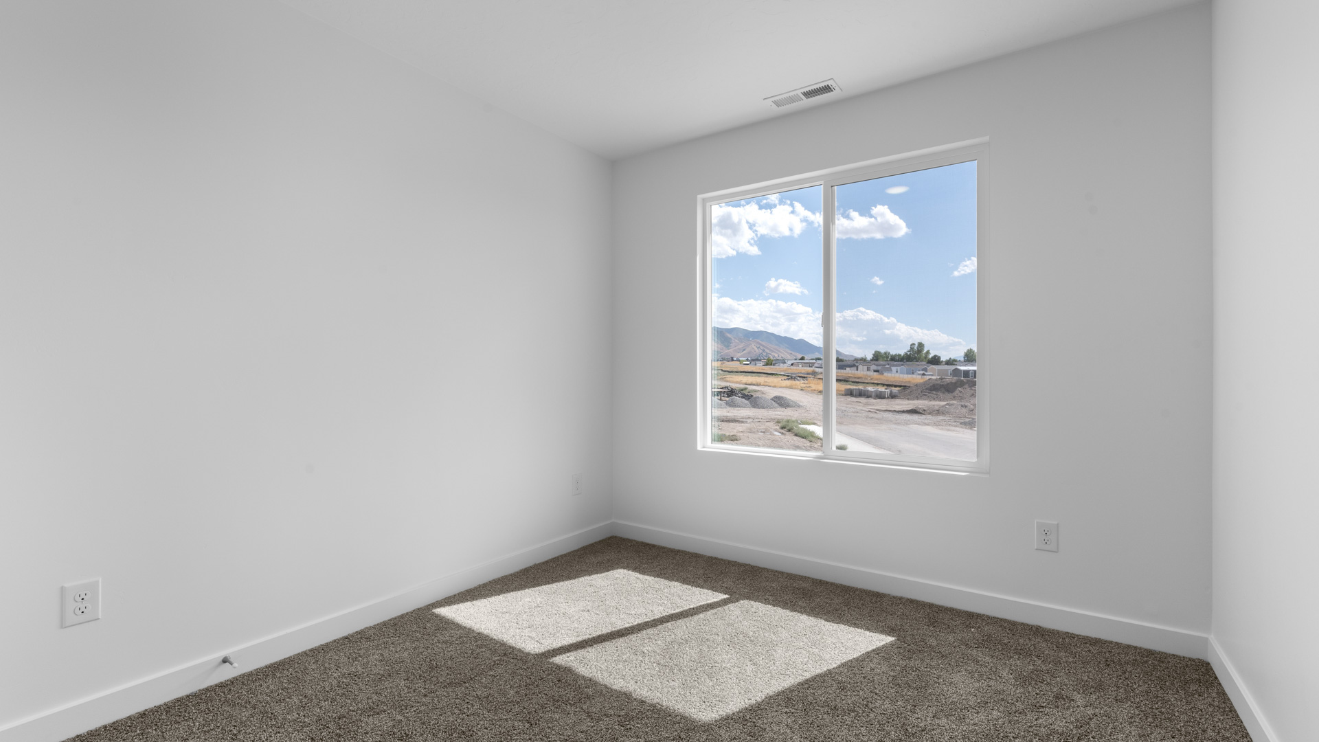 Bedroom with large window.