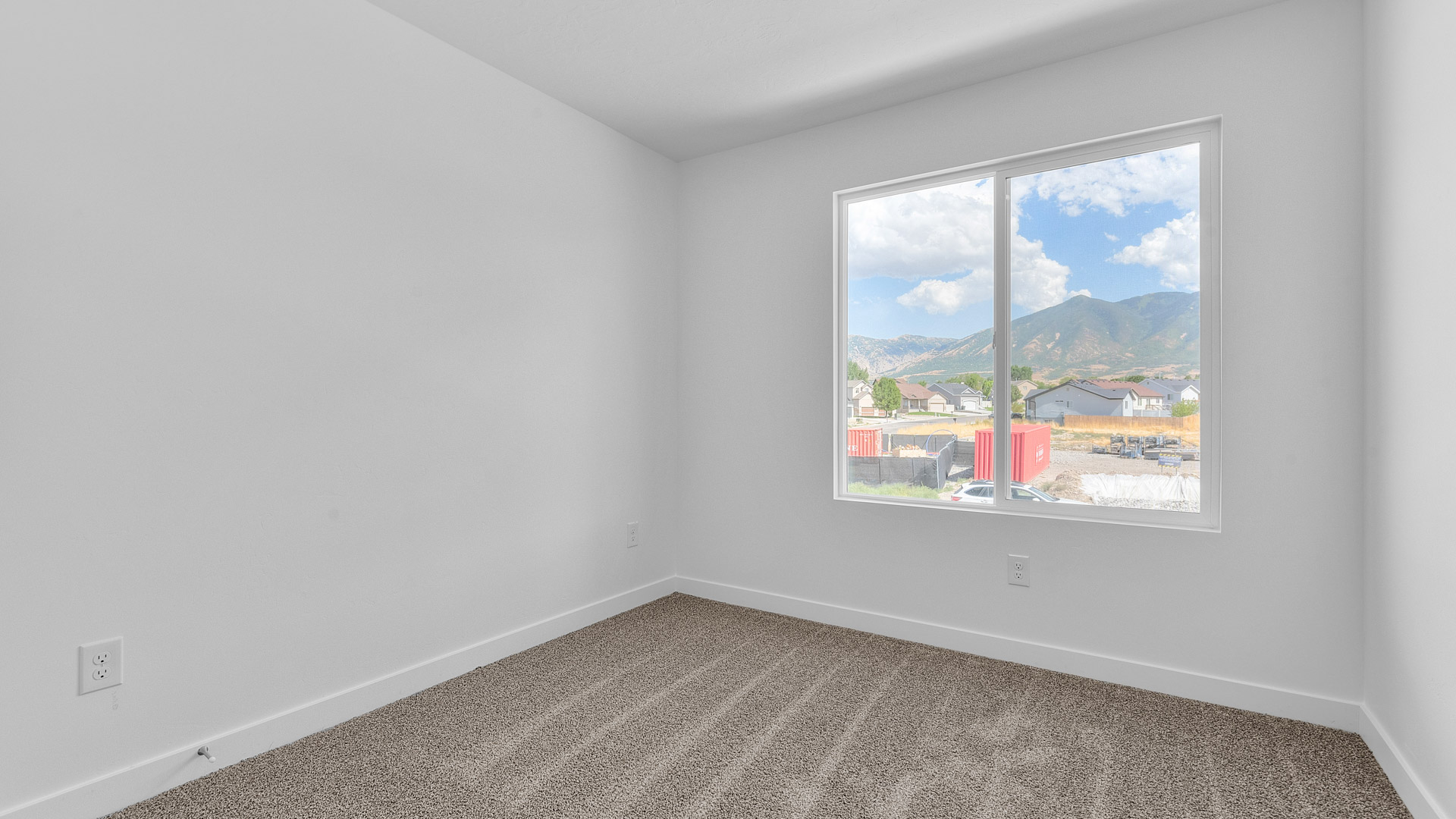 Bedroom with large window.
