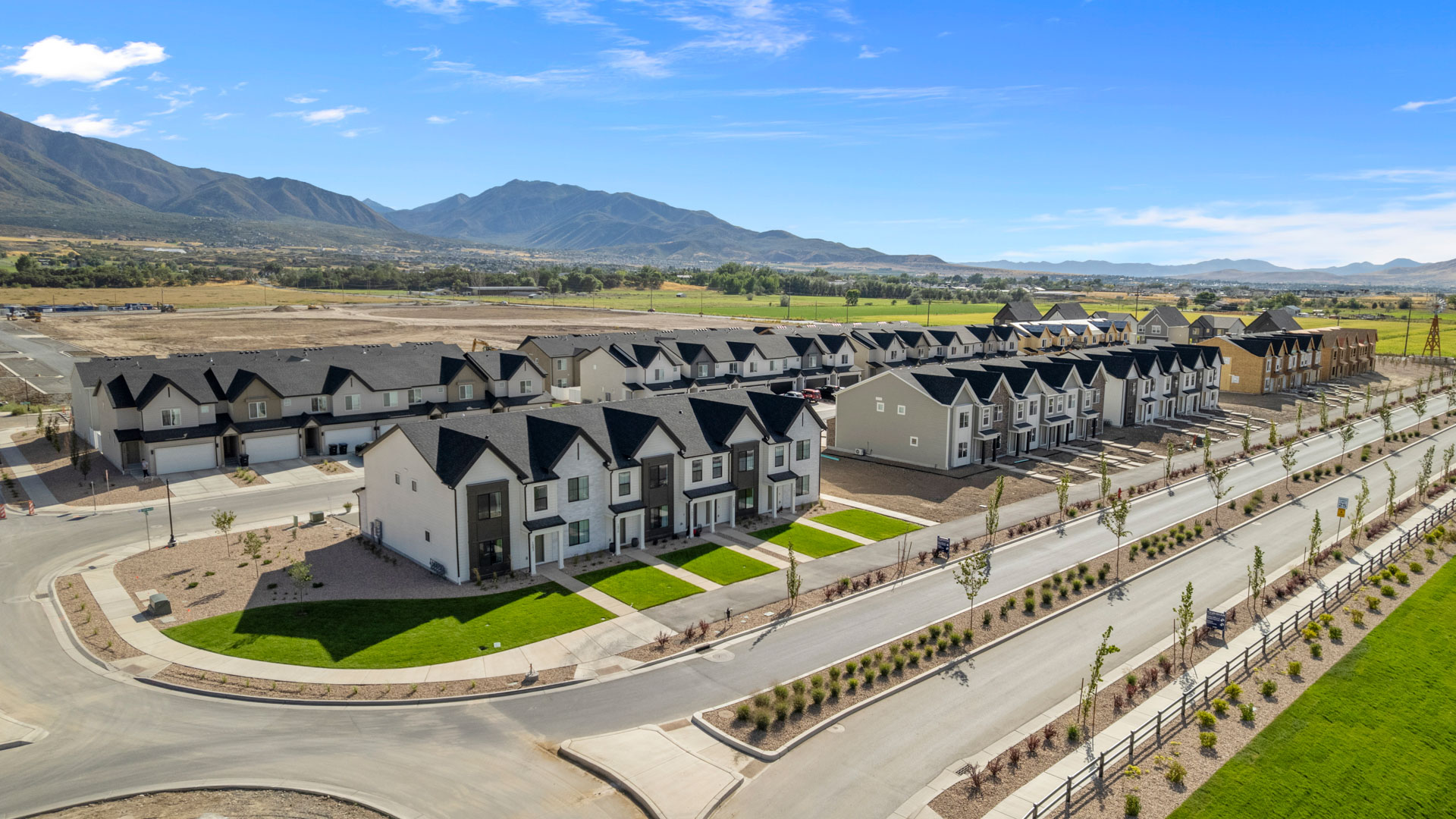 Viridian community aerial showcasing homes being built and mountains.
