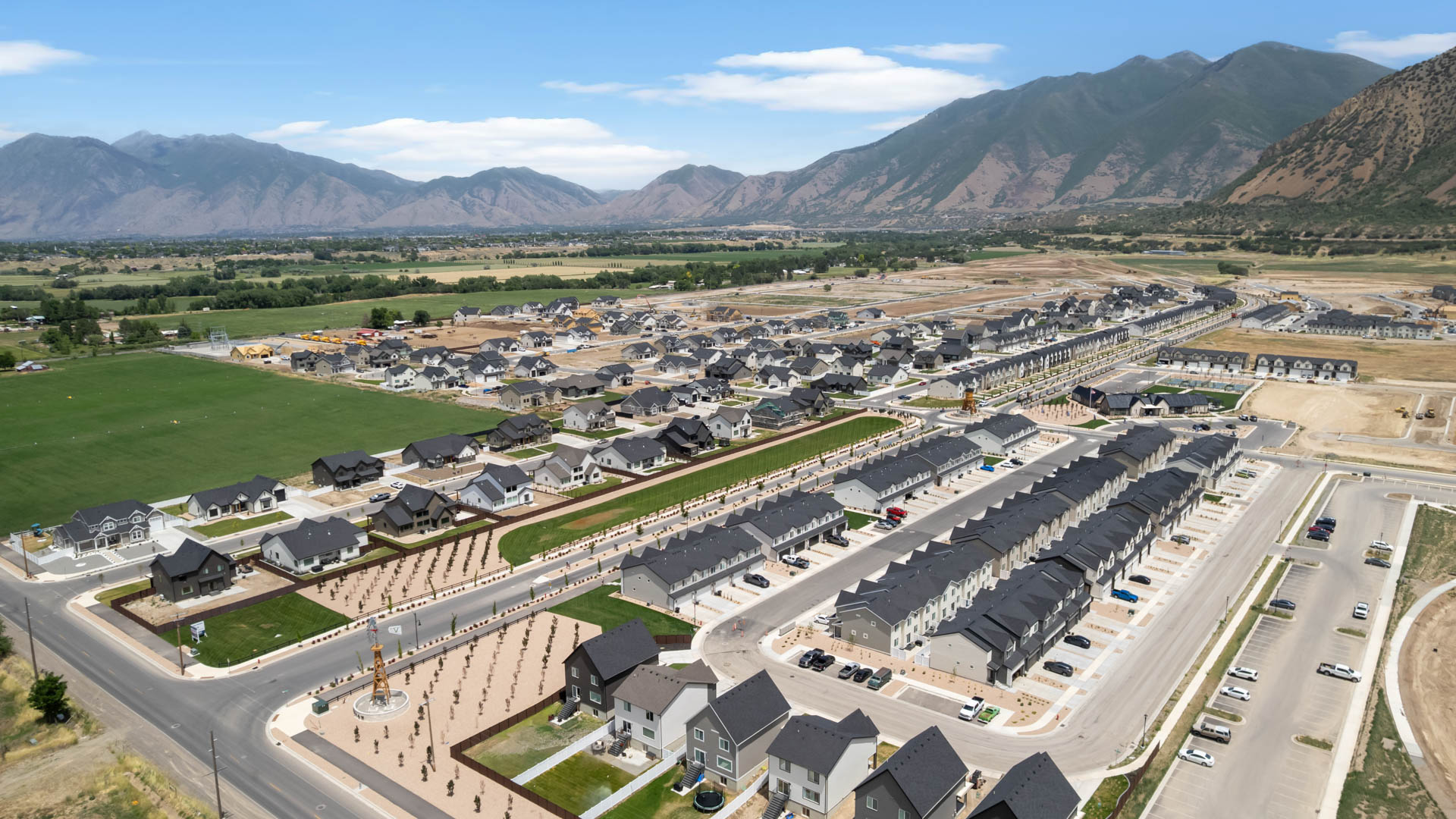 Viridian community aerial showcasing homes being built and mountains.
