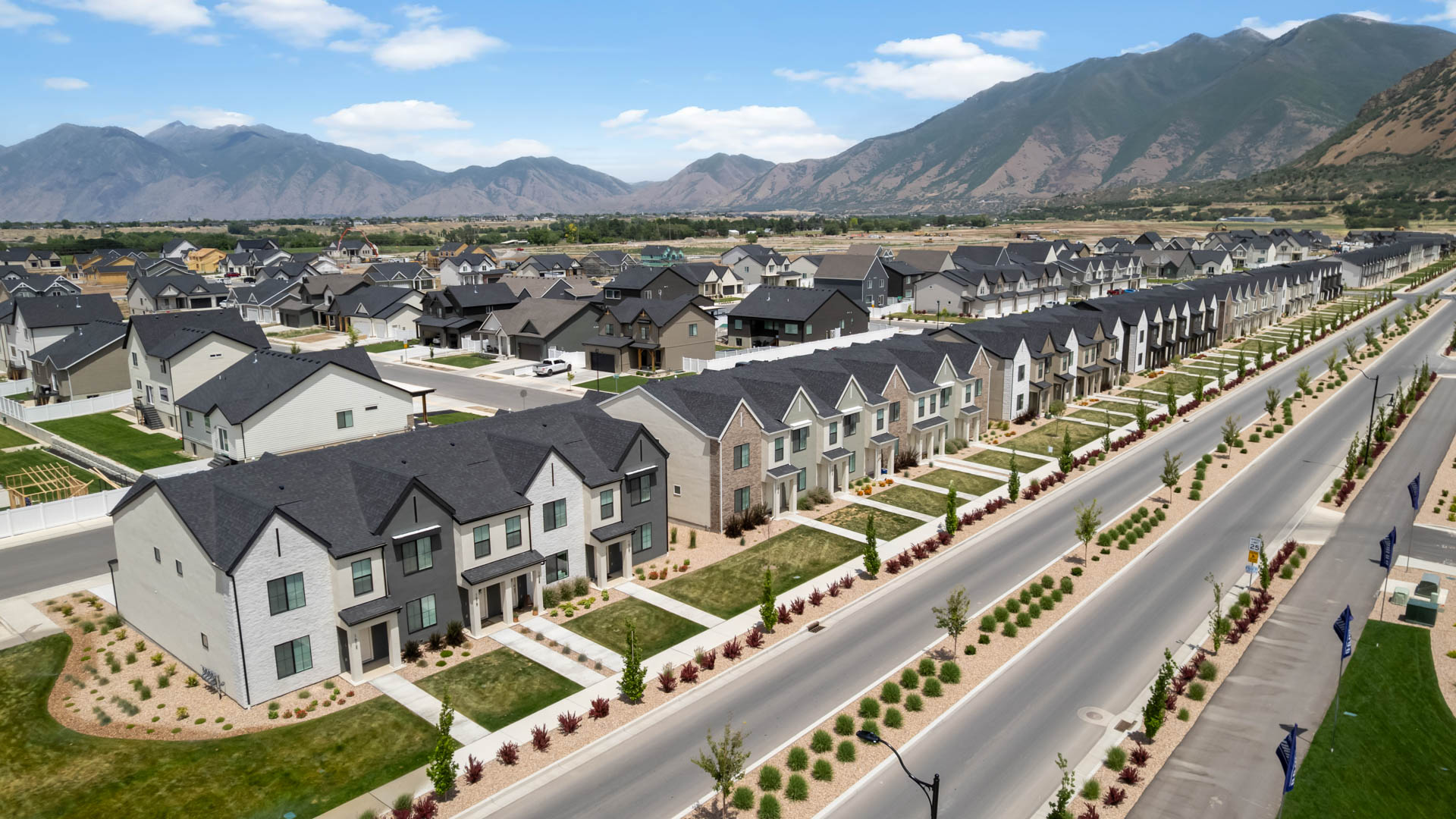 Viridian community aerial showcasing homes being built and mountains.