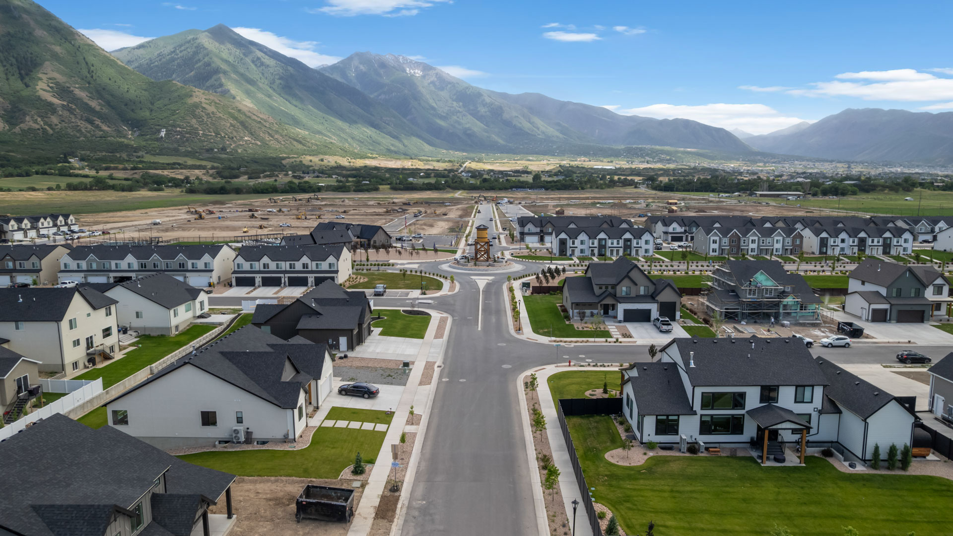 Viridian community aerial showcasing homes being built and mountains.