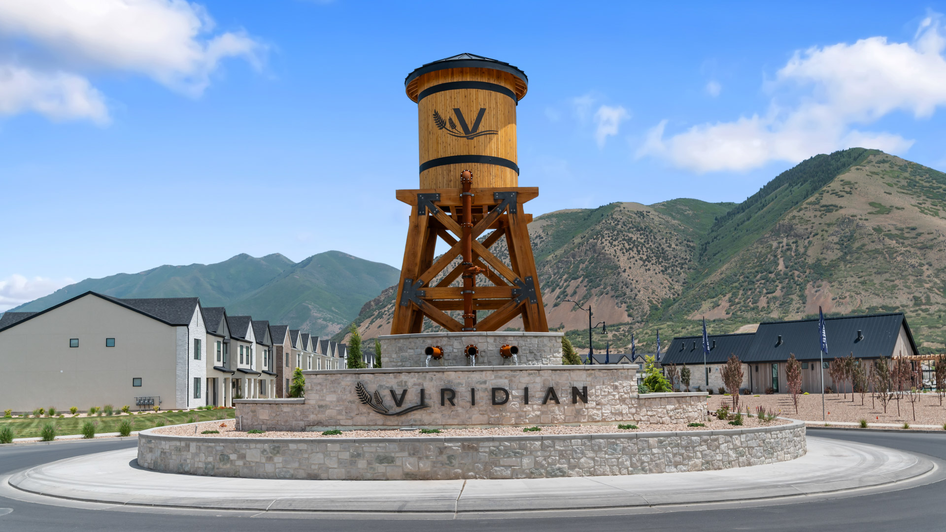 Viridian community aerial showcasing homes being built and mountains.